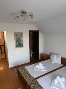 Postel nebo postele na pokoji v ubytování Casa Donau Beach