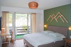 Postel nebo postele na pokoji v ubytování SWISSME - Neu-Seeblick-Balkon-Parkplatz-Nahe Bergbahn