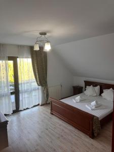 Postel nebo postele na pokoji v ubytování Casa Donau Beach