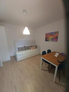 a living room with a couch and a table at Apartman Ariana in Gradac