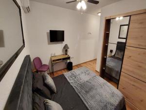 TV a/nebo společenská místnost v ubytování 4 Colors Rooms, Cres
