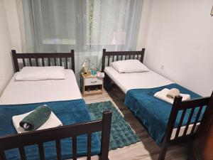 Postelja oz. postelje v sobi nastanitve Apartmani, sobe Žiža