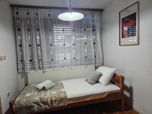 Postelja oz. postelje v sobi nastanitve Apartmani, sobe Žiža