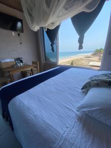 Postel nebo postele na pokoji v ubytování Hotel Mulata