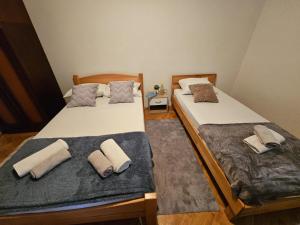 Postelja oz. postelje v sobi nastanitve Apartmani, sobe Žiža