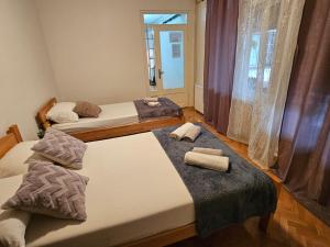 Postelja oz. postelje v sobi nastanitve Apartmani, sobe Žiža
