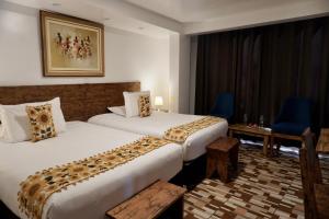Voodi või voodid majutusasutuse Hotel Tara Machupicchu toas