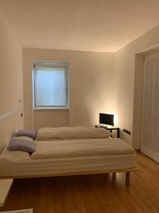 Postel nebo postele na pokoji v ubytování Agritur Stefenelli