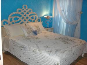 Ένα ή περισσότερα κρεβάτια σε δωμάτιο στο Solemar Apartment