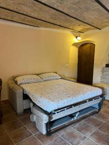 a bedroom with a bed in a room at La casetta - Casa vacanze in Montenero Val Cocchiara