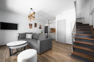 a living room with a couch and a table at Nikiti Summer Gem 1 by Luxlikehome in Nikiti