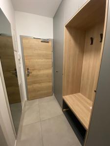 a walk in closet with a wooden door at Oasis of Energy in Ljubljana +9 photos