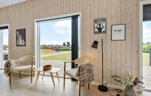 a living room with two chairs and a window at Pet Friendly Home In Hemmet With Wifi in Hemmet