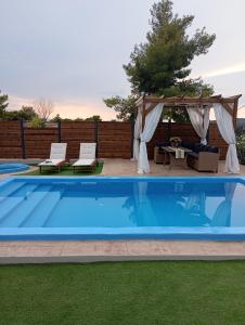 The swimming pool at or close to Villa Red Porto Cheli