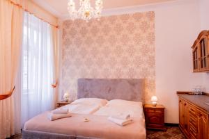 Letto o letti in una camera di Hotel Praga
