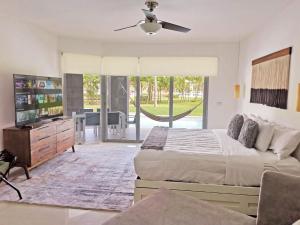 a bedroom with two beds and a ceiling fan at Casamarmareazul in Playa del Carmen +38 photos