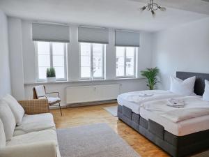 Ένα ή περισσότερα κρεβάτια σε δωμάτιο στο Apartment DOM III - Erfurt Domplatz
