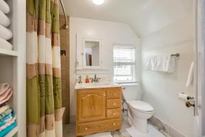 a bathroom with a toilet and a sink and a mirror at Alameda 3BR Penthouse 2 blocks to downtown 3 blocks to the beach AC and 2 free parking spaces in Alameda +43 photos