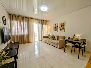 a living room with a couch and a table at Apartment in Club Paraiso Ocean View, Wi-Fi in Playa Paraiso