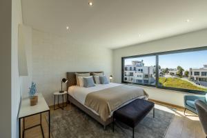Ένα ή περισσότερα κρεβάτια σε δωμάτιο στο Silver Coast Beach Villa