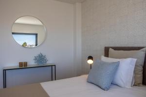Ένα ή περισσότερα κρεβάτια σε δωμάτιο στο Silver Coast Beach Villa