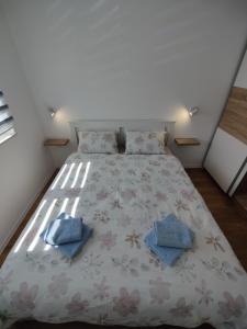 Postel nebo postele na pokoji v ubytování Sunflower Apartments