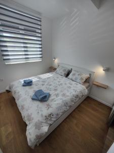 Postel nebo postele na pokoji v ubytování Sunflower Apartments