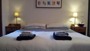 Säng eller sängar i ett rum på Locanda del Sole Nero