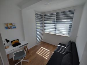 TV a/nebo společenská místnost v ubytování Sunflower Apartments