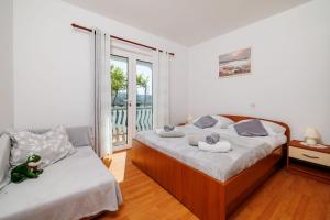 Postel nebo postele na pokoji v ubytování Apartments Klara