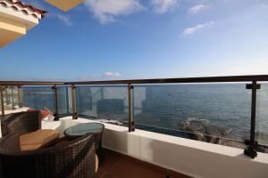 a balcony with a view of the ocean at Apartments La Caleta Sunrises in Adeje