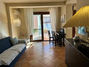 a living room with a couch and a table at Casa vacanze La Chicca in Capo dʼOrlando