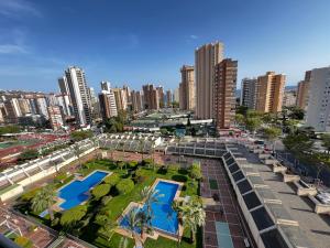 an aerial view of a city with two swimming pools at Beautifull Apartment in Benidorm in Benidorm
