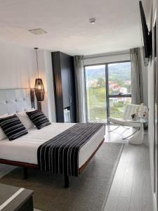 Postel nebo postele na pokoji v ubytování Hotel Noia