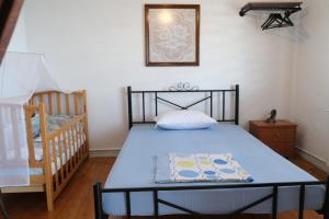 Postel nebo postele na pokoji v ubytování MangoSeaview Home1