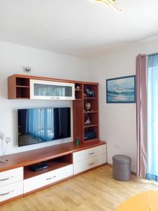 a living room with a large entertainment center with a tv at Tina in Pula