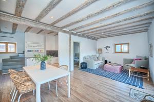 a living room with a table and chairs at Hvar luxury Villa and pool with view in heart of Stari Grad in Stari Grad