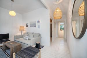 a living room with a couch and a table at Hvar luxury Villa and pool with view in heart of Stari Grad in Stari Grad