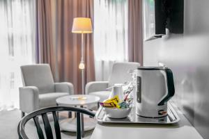TV a/nebo společenská místnost v ubytování Corvin Hotel Budapest Corvin Wing