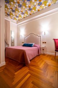 Postel nebo postele na pokoji v ubytování Boutique Hotel Puccini