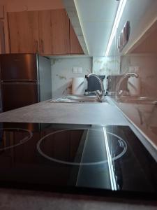 Kuchyň nebo kuchyňský kout v ubytování Alana apartment