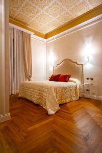 Postel nebo postele na pokoji v ubytování Boutique Hotel Puccini