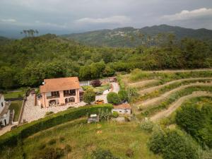 an aerial view of a house on a hill at holiday House Na Te in Riccò del Golfo di Spezia