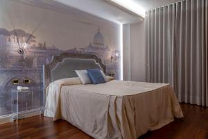 Postel nebo postele na pokoji v ubytování Boutique Hotel Puccini
