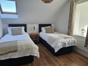 Postel nebo postele na pokoji v ubytování Sea Breeze