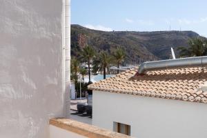a view from a balcony of a building with a mountain at casa en puerto javea in Jávea