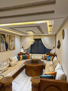 a large living room with couches and a table at اقامة نور in Nador