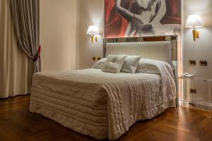 Postel nebo postele na pokoji v ubytování Boutique Hotel Puccini