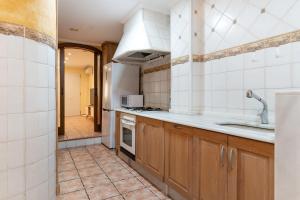 a kitchen with a sink and a stove top oven at casa en puerto javea in Jávea