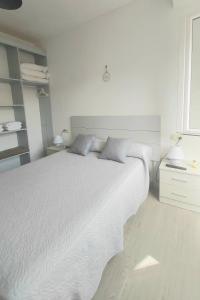 En eller flere senge i et værelse på Novama